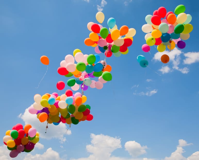 Lots of colorful balloons on the sky background