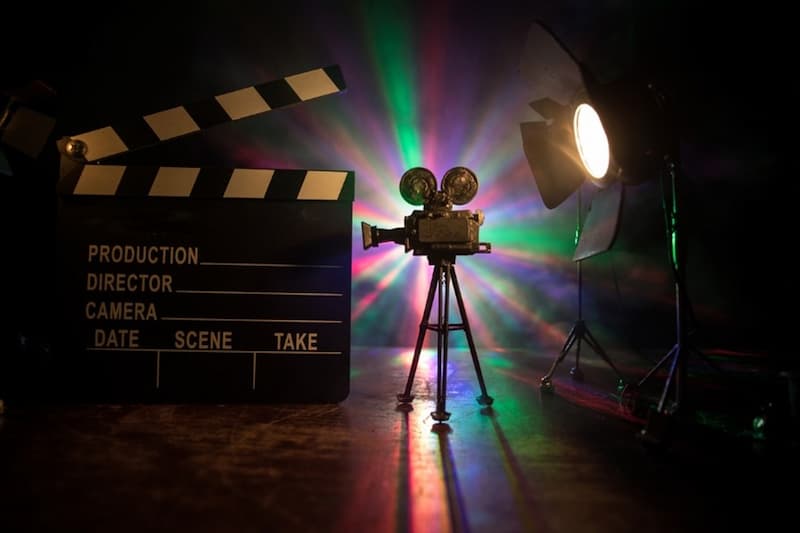 A movie camera and a movie clapper board